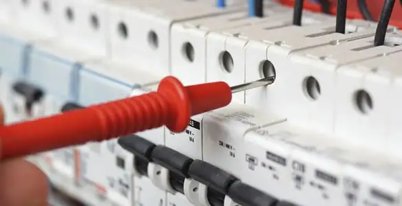 Electrical contractor testing circuit breakers during electrical repair in Jamestown, MO