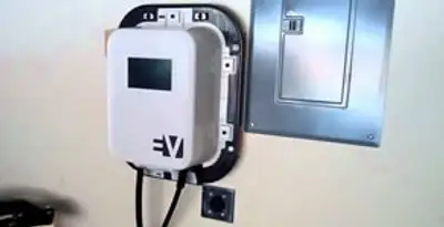 Electric car charger installation with wall-mounted EV charging station in Columbia, MO