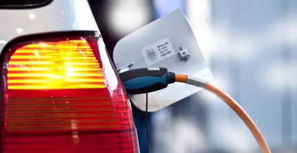 Electric car plugged into EV charger after professional installation in Columbia, MO