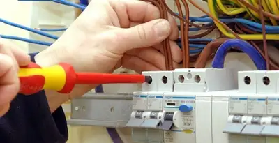 electrician services performing professional electrical panel wiring and connections in Columbia, MO