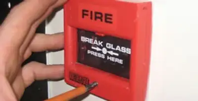 fire alarm installation service showing manual fire alarm pull station installed by licensed electricians in Columbia, MO