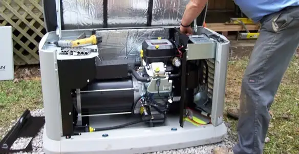 generator installation service showing technician connecting and configuring generator components in Columbia, MO