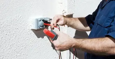 Electrician performing home electrical outlet and wiring inspection in Columbia, MO