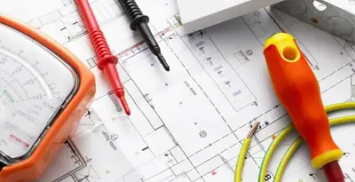licensed electrician planning and testing electrical systems using professional tools in Columbia, MO