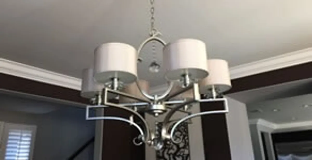 Modern chandelier installation with multiple light fixtures in Columbia, MO