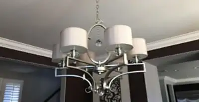 Modern chandelier installation with multiple light fixtures in Columbia, MO