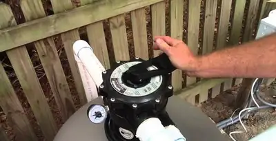 pool pumps service showing professional adjustment of pool pump control system in Columbia, MO