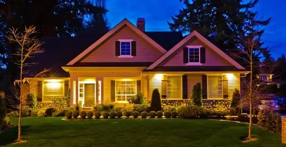 security light installation services illuminating a residential exterior at night in Columbia, MO