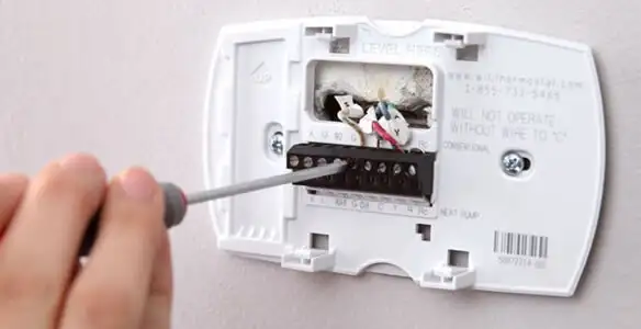 Thermostat installation service with proper wiring and secure wall mounting in Columbia, MO