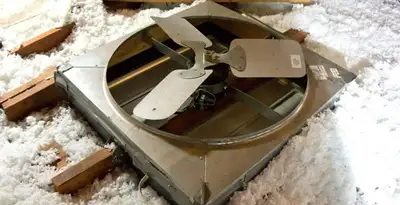whole house fan installation services with attic-mounted ventilation unit in Columbia, MO